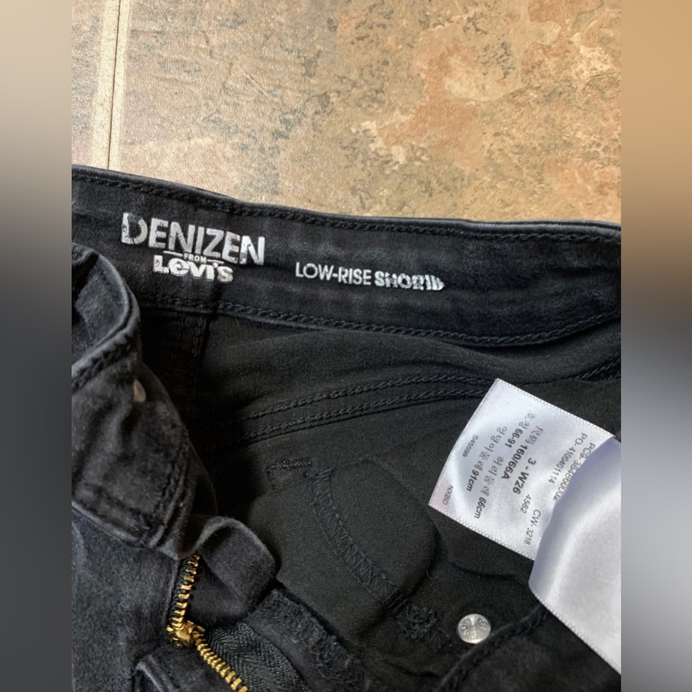 Levi’s black jean shorts.
